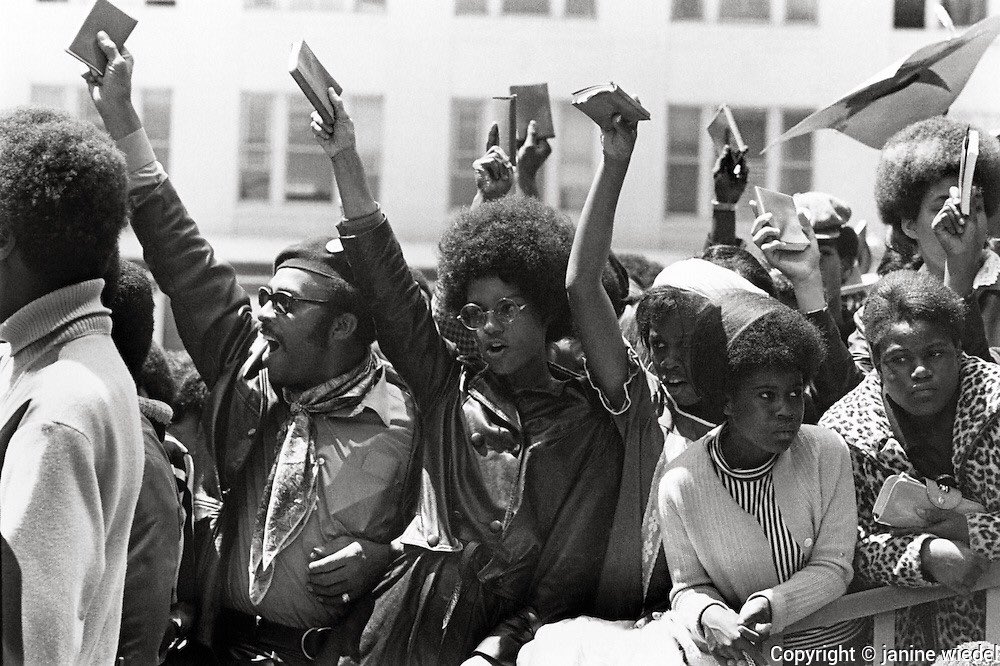 Members of the Black Panthers raising their copy of the Little Red Book in protest to free Huey Newton.